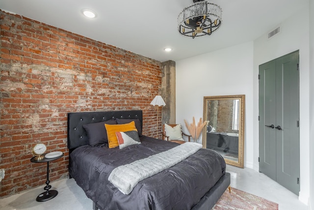 117 E 7th St Unit 302, Chattanooga, TN 37402 - bedroom with a chandelier, recessed lighting, and finished concrete flooring