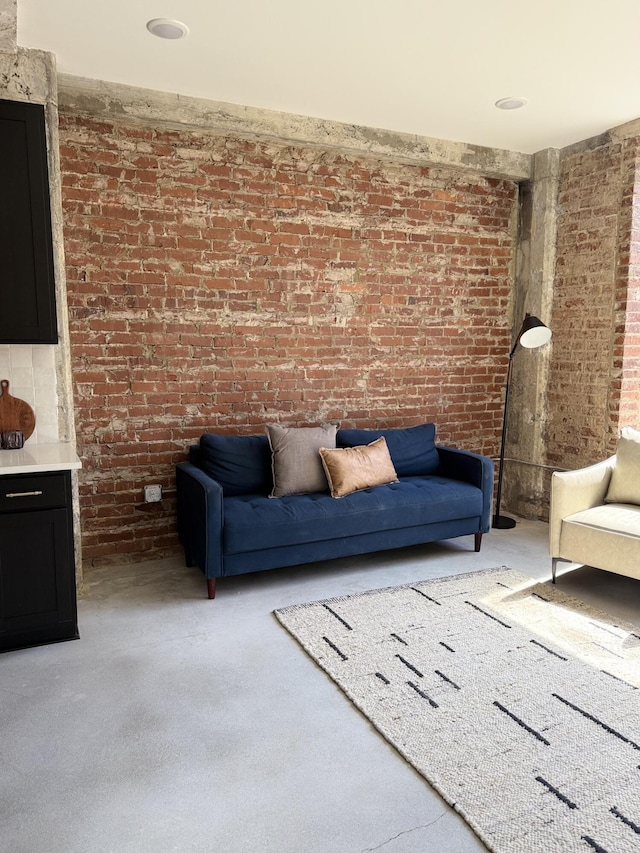117 E 7th St Unit 206, Chattanooga, TN 37402 - living area featuring brick wall and carpet flooring