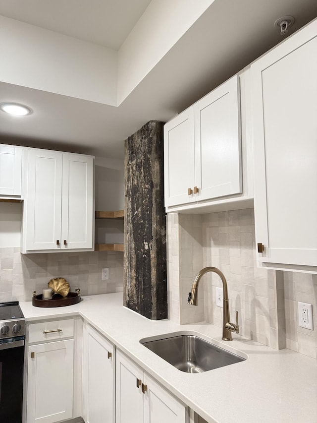 117 E 7th St Unit 503, Chattanooga, TN 37402 - kitchen featuring open shelves, a sink, stainless steel range with electric stovetop, and tasteful backsplash