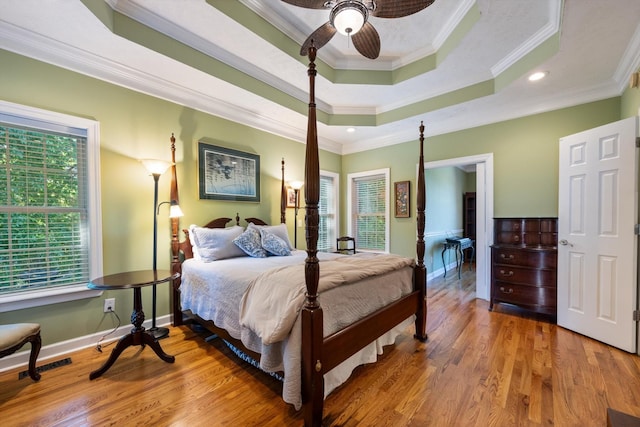 502 Tarver Ct, Smyrna, TN 37167 - bedroom featuring ornamental molding, wood finished floors, baseboards, recessed lighting, and a tray ceiling