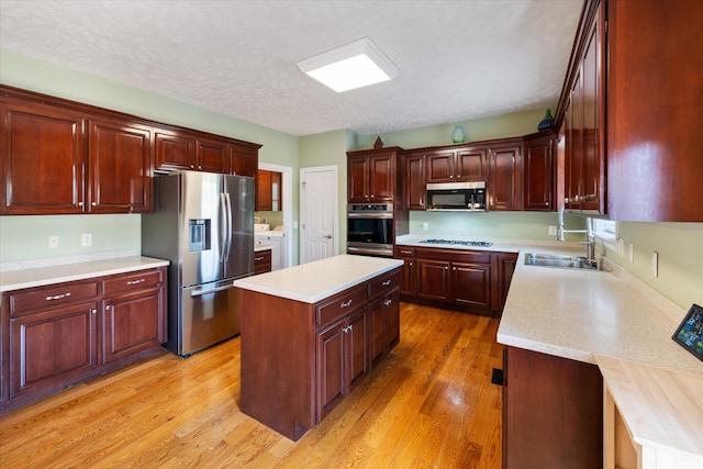 502 Tarver Ct, Smyrna, TN 37167 - kitchen with appliances with stainless steel finishes, a sink, light countertops, and light wood-type flooring