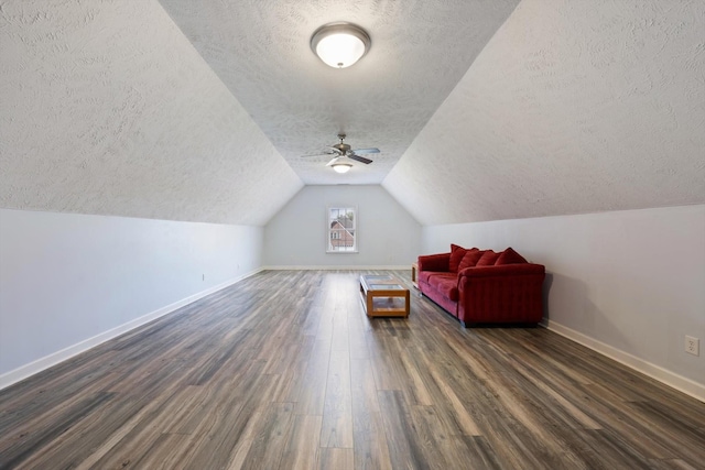 502 Tarver Ct, Smyrna, TN 37167 - bonus room featuring a textured ceiling, dark wood finished floors, baseboards, ceiling fan, and lofted ceiling