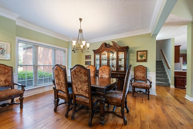 502 Tarver Ct, Smyrna, TN 37167 - dining area with a chandelier, ornamental molding, stairway, and wood finished floors