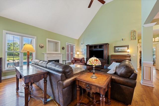 502 Tarver Ct, Smyrna, TN 37167 - living room with a ceiling fan, a fireplace, wood finished floors, high vaulted ceiling, and baseboards