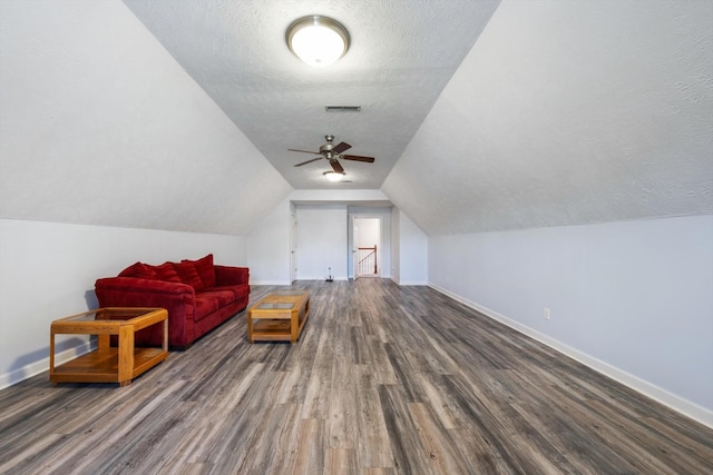 502 Tarver Ct, Smyrna, TN 37167 - additional living space featuring baseboards, dark wood-type flooring, a textured ceiling, lofted ceiling, and ceiling fan