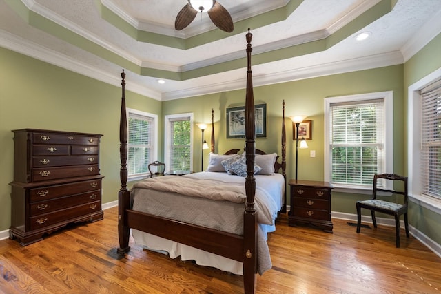 502 Tarver Ct, Smyrna, TN 37167 - bedroom featuring wood finished floors, a raised ceiling, baseboards, crown molding, and recessed lighting