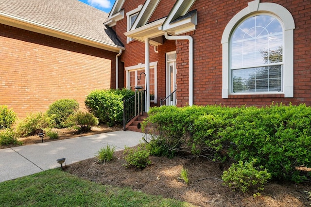 502 Tarver Ct, Smyrna, TN 37167 - doorway to property featuring brick siding and roof with shingles
