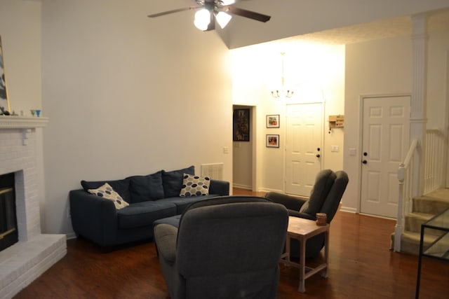 103 Cypress Ct, White House, TN 37188 - living room featuring a ceiling fan, a fireplace, wood finished floors, a chandelier, and baseboards