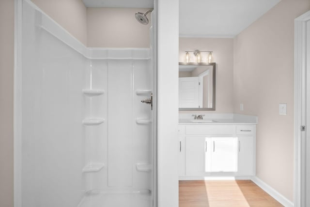 102 Colson Rd, Dover, TN 37058 - full bathroom featuring a shower, vanity, wood finished floors, and baseboards