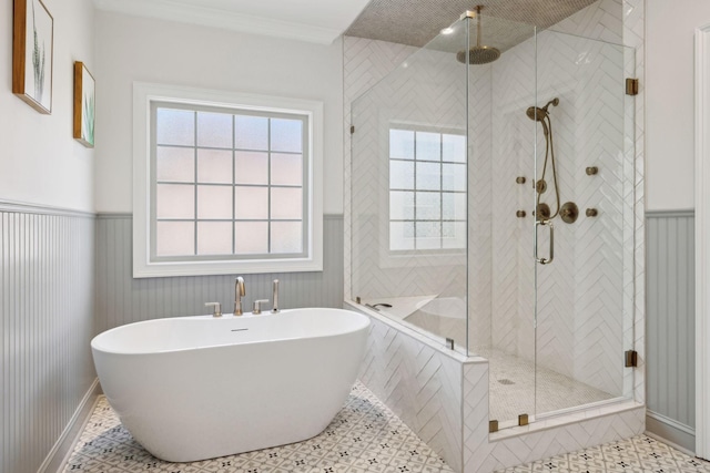 3317 Clovercroft Dr, Murfreesboro, TN 37130 - bathroom featuring a freestanding tub, a shower stall, and wainscoting