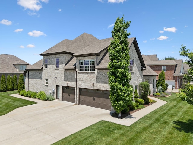 3317 Clovercroft Dr, Murfreesboro, TN 37130 - view of side of property featuring a garage, driveway, a lawn, and brick siding