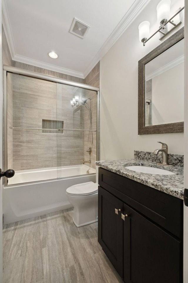 3317 Clovercroft Dr, Murfreesboro, TN 37130 - bathroom with toilet, vanity, ornamental molding, bath / shower combo with glass door, and wood finished floors