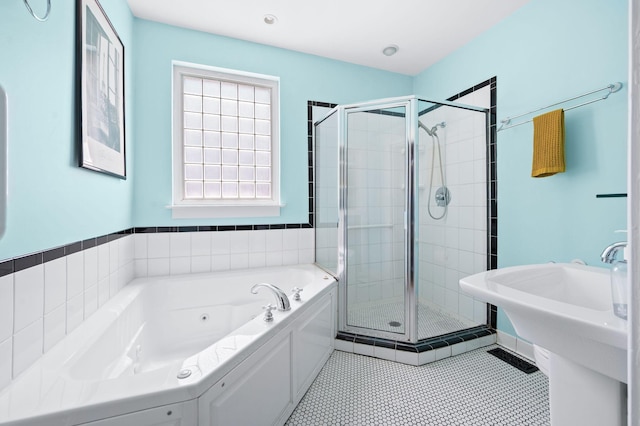 802 N 16th St, Nashville, TN 37206 - full bath featuring a jetted tub, a shower stall, and tile patterned floors