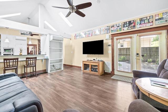 802 N 16th St, Nashville, TN 37206 - living area featuring ceiling fan, a wall mounted AC, baseboards, wood finished floors, and high vaulted ceiling