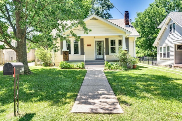 802 N 16th St, Nashville, TN 37206 - bungalow featuring a chimney, a porch, and roof with shingles
