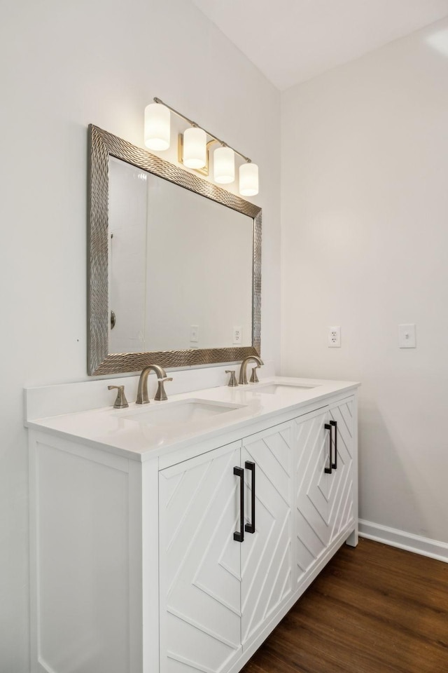 808 Split Oak Ct, Antioch, TN 37013 - bathroom featuring double vanity, wood finished floors, and baseboards