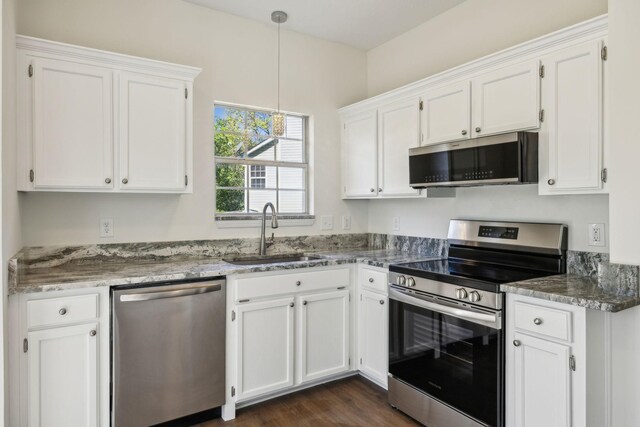 808 Split Oak Ct, Antioch, TN 37013 - kitchen featuring appliances with stainless steel finishes, a sink, white cabinets, stone countertops, and hanging light fixtures