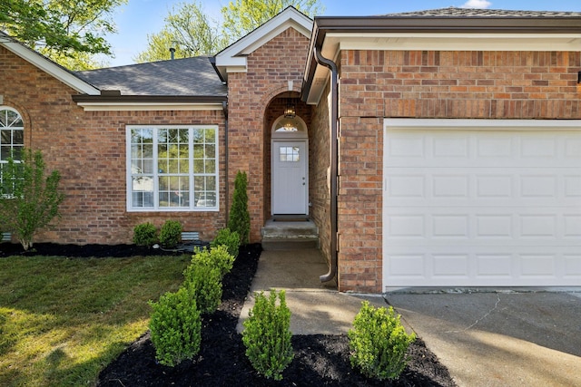 808 Split Oak Ct, Antioch, TN 37013 - entrance to property featuring brick siding, an attached garage, a shingled roof, and a yard