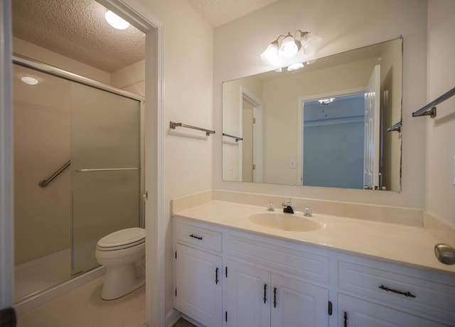 936 E Northfield Blvd, Murfreesboro, TN 37130 - bathroom with toilet, vanity, a textured ceiling, a stall shower, and tile patterned flooring