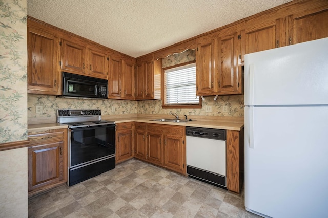 936 E Northfield Blvd, Murfreesboro, TN 37130 - kitchen featuring black appliances, a sink, brown cabinets, wallpapered walls, and a textured ceiling