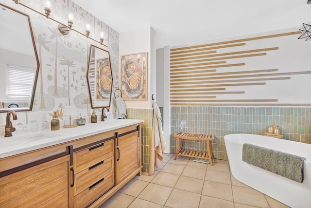 8801 Cedar Grove Rd, Cross Plains, TN 37049 - bathroom with double vanity, a soaking tub, tile patterned floors, wainscoting, and tile walls