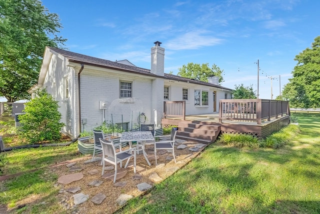 8801 Cedar Grove Rd, Cross Plains, TN 37049 - rear view of property featuring a chimney, brick siding, a wooden deck, and a lawn