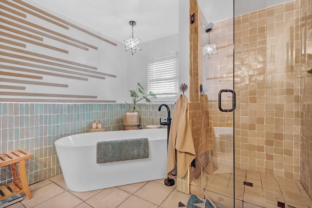8801 Cedar Grove Rd, Cross Plains, TN 37049 - full bath featuring tile walls, a stall shower, a freestanding bath, tile patterned flooring, and a wainscoted wall