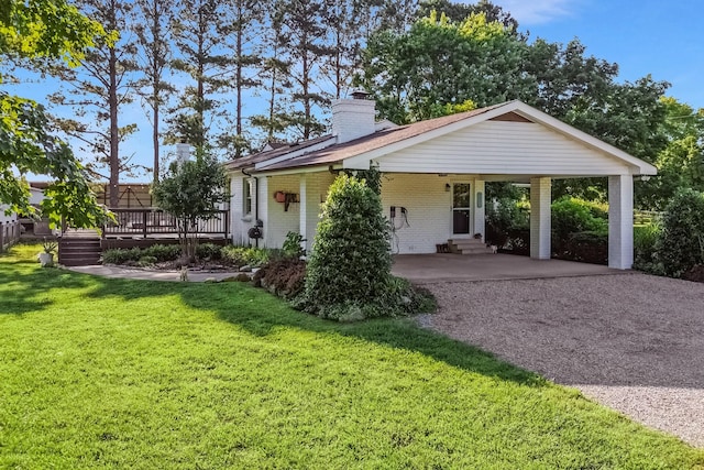 8801 Cedar Grove Rd, Cross Plains, TN 37049 - rear view of house featuring entry steps, a chimney, brick siding, a lawn, and gravel driveway