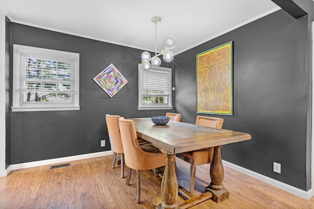 8801 Cedar Grove Rd, Cross Plains, TN 37049 - dining space featuring crown molding, baseboards, plenty of natural light, and wood finished floors