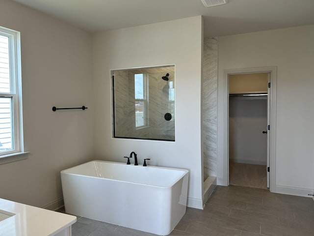 5416 Bridgemore Blvd, Murfreesboro, TN 37129 - full bathroom with a tile shower, a freestanding tub, vanity, and a spacious closet