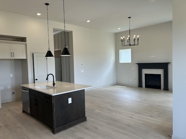 5416 Bridgemore Blvd, Murfreesboro, TN 37129 - kitchen featuring a sink, stainless steel dishwasher, light wood-type flooring, light countertops, and a kitchen island with sink