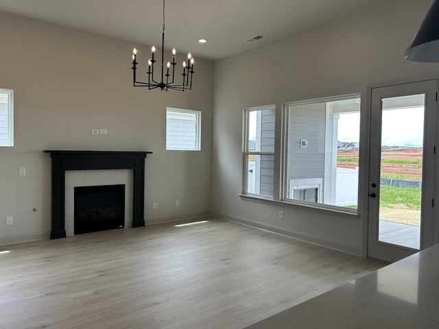 5416 Bridgemore Blvd, Murfreesboro, TN 37129 - unfurnished living room featuring wood finished floors, a chandelier, a fireplace, baseboards, and recessed lighting