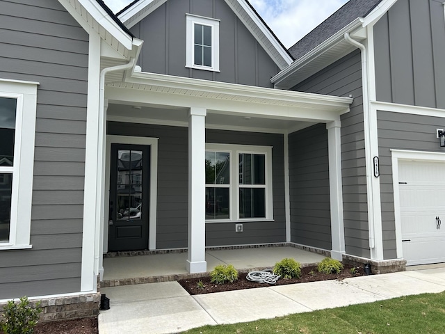 5416 Bridgemore Blvd, Murfreesboro, TN 37129 - view of exterior entry featuring board and batten siding, a porch, and a garage