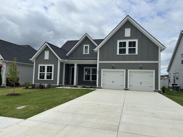 5416 Bridgemore Blvd, Murfreesboro, TN 37129 - view of front of house featuring board and batten siding, driveway, cooling unit, a front lawn, and an attached garage