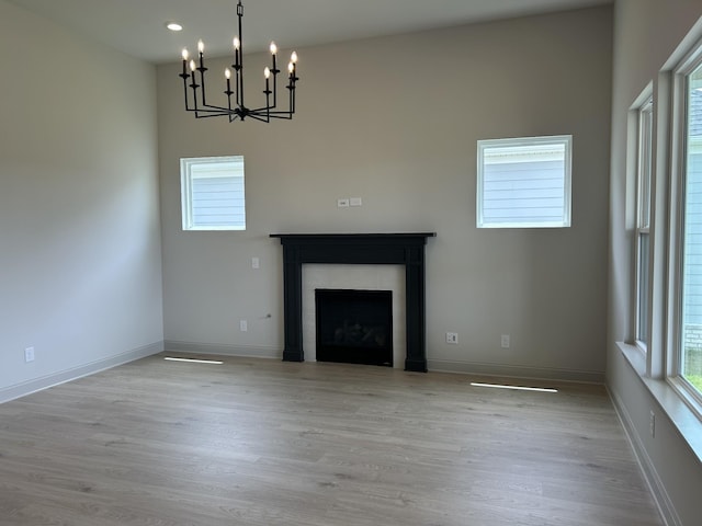 5416 Bridgemore Blvd, Murfreesboro, TN 37129 - unfurnished living room featuring a chandelier, a fireplace, wood finished floors, and recessed lighting