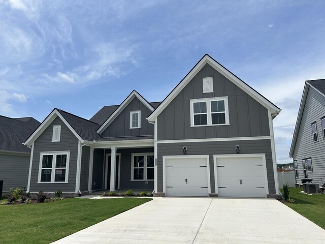 5416 Bridgemore Blvd, Murfreesboro, TN 37129 - view of front of property featuring board and batten siding, concrete driveway, a front yard, and a garage