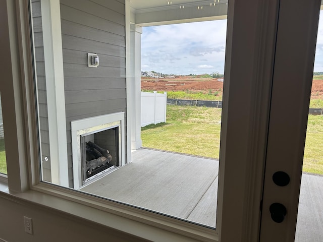 5416 Bridgemore Blvd, Murfreesboro, TN 37129 - doorway to outside with exterior fireplace, ornamental molding, and a view of countryside