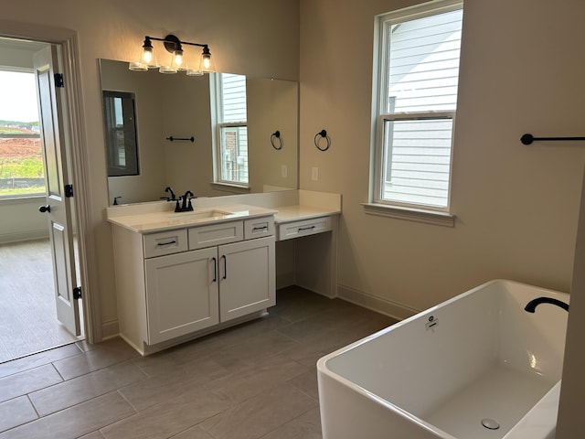 5416 Bridgemore Blvd, Murfreesboro, TN 37129 - full bath featuring vanity, a freestanding tub, and tile patterned floors
