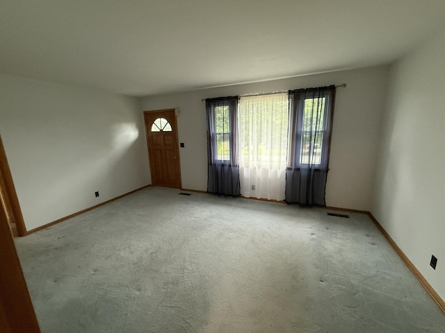 563 Ashe Ave, New Johnsonville, TN 37134 - entrance foyer with baseboards and light carpet