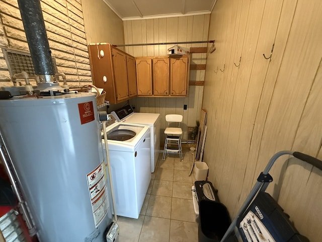 563 Ashe Ave, New Johnsonville, TN 37134 - laundry room featuring water heater, washing machine and dryer, cabinet space, ornamental molding, and wood walls