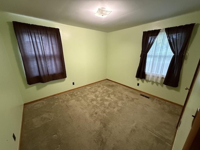563 Ashe Ave, New Johnsonville, TN 37134 - carpeted spare room with baseboards
