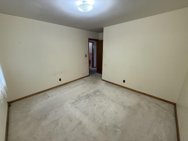 563 Ashe Ave, New Johnsonville, TN 37134 - unfurnished room featuring light carpet and baseboards
