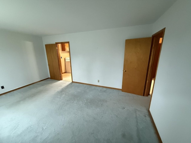 563 Ashe Ave, New Johnsonville, TN 37134 - unfurnished bedroom featuring baseboards, carpet, and ensuite bath
