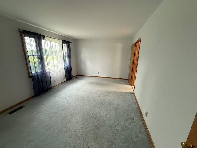 563 Ashe Ave, New Johnsonville, TN 37134 - empty room featuring light carpet and baseboards