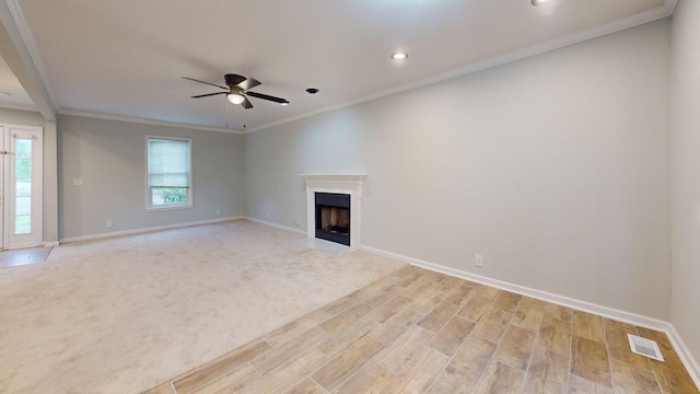 3012 Owendale Dr, Antioch, TN 37013 - unfurnished living room with a ceiling fan, baseboards, crown molding, a fireplace with flush hearth, and recessed lighting