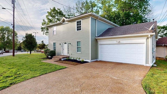 3012 Owendale Dr, Antioch, TN 37013 - view of front of property featuring concrete driveway, a front yard, and an attached garage