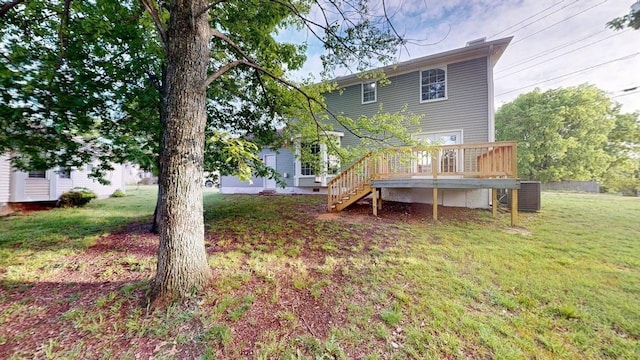 3012 Owendale Dr, Antioch, TN 37013 - rear view of house with stairway, a wooden deck, a yard, and central AC
