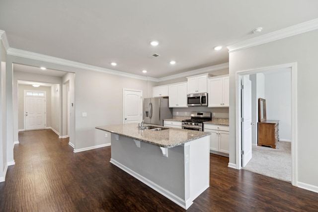 778 Prominence Rd, Columbia, TN 38401 - kitchen featuring appliances with stainless steel finishes, a kitchen island with sink, white cabinetry, dark wood finished floors, and a sink
