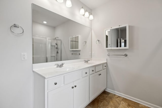 778 Prominence Rd, Columbia, TN 38401 - bathroom with double vanity, baseboards, and a stall shower