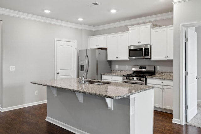 778 Prominence Rd, Columbia, TN 38401 - kitchen featuring stainless steel appliances, dark wood-style floors, a center island with sink, a sink, and white cabinetry